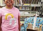 A student displays her self-made creation at Eastland Library’s summer program